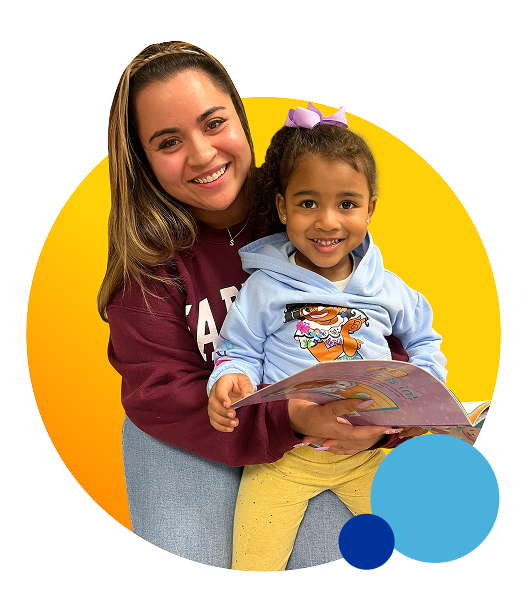 teaching holding a child with a book